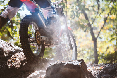 Man riding motorcycle on rock