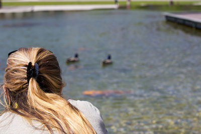 Rear view of woman in lake