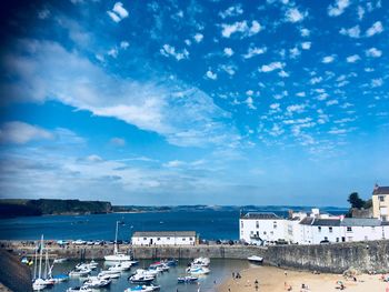 High angle view of sea by buildings against sky