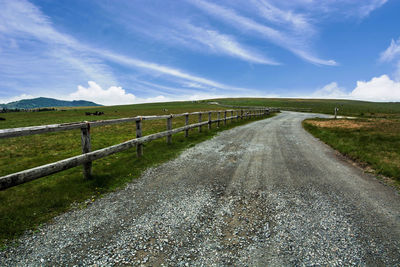 Country road passing through landscape
