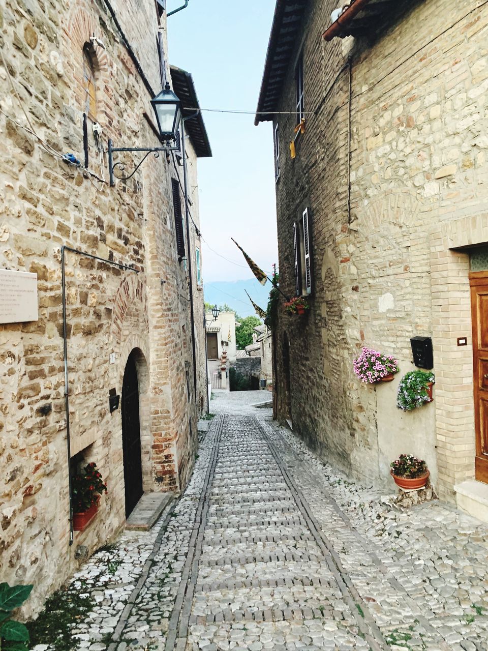 NARROW FOOTPATH AMIDST BUILDINGS