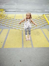 Full length of a smiling girl playing