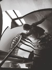 Low angle view of man standing in boat