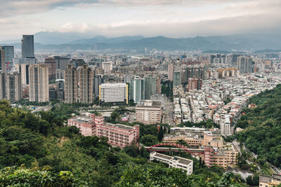 High angle view of buildings in city against sky