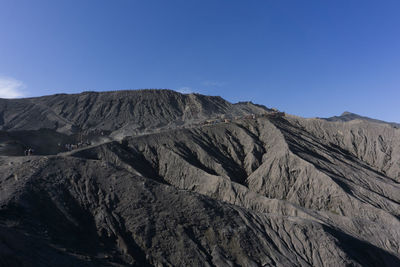 Scenic view of rocky mountains against sky mount bromo