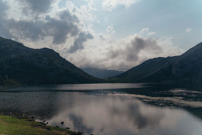 Scenic view of lake and mountains against sky