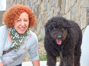 Portrait of a smiling woman with dog