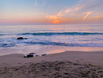 Scenic view of sea against sky during sunset