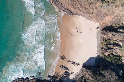 High angle view of rocks in sea