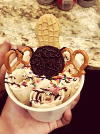 Close-up of hand holding ice cream