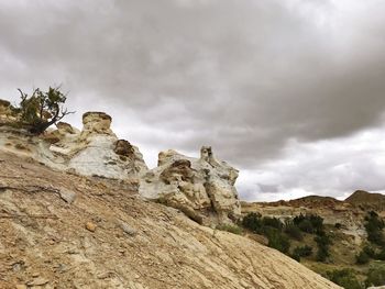 Low angle view of rock formations against sky