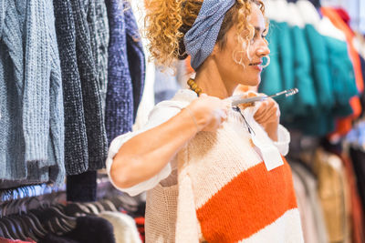 Midsection of woman looking at camera