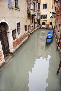 High angle view of gondola moored in canal