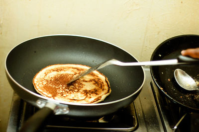 High angle view of pancakes in cooking pan