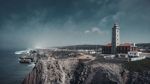 Panoramic view of sea and buildings against sky