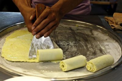 Close-up of man preparing food