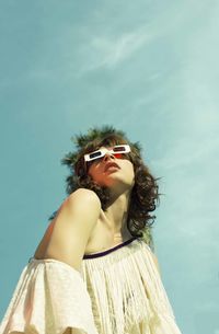 Low angle portrait of woman looking at camera