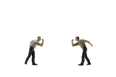 Full length of friends standing against white background