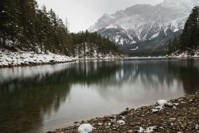 Idyllic shot of mountains and lake against sky