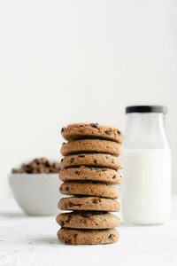 Close-up of cookies on table against white background