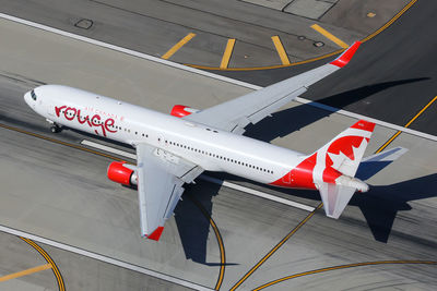 High angle view of airplane on airport runway