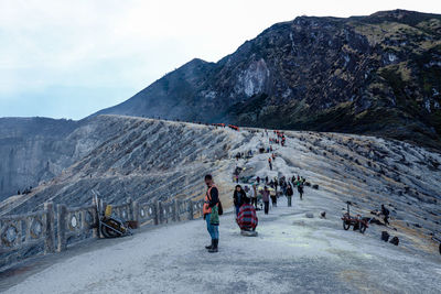 Group of people on mountain road