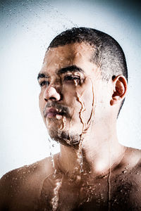 Portrait of shirtless man in water