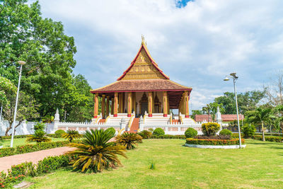 Temple building against cloudy sky