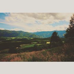 Scenic view of landscape against cloudy sky