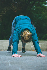 Woman exercising on road