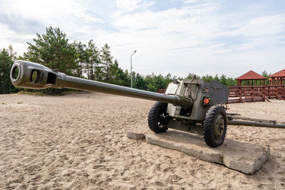 Vintage car on land against sky