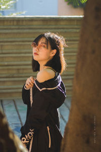 Side view of young woman looking away