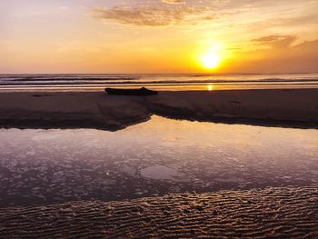 Scenic view of sea against sky at sunset