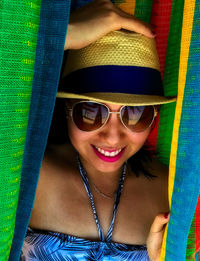 Portrait of smiling young woman wearing hat