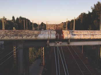 Train on railroad tracks against clear sky