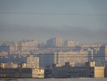 Buildings in city against sky
