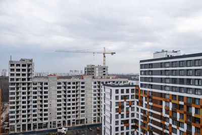 Buildings in city against sky