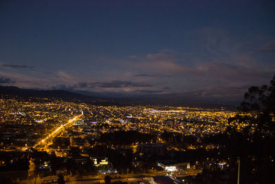 High angle view of illuminated buildings in city at night