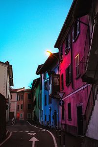 Street amidst buildings against sky