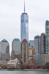 Skyscrapers in city against sky