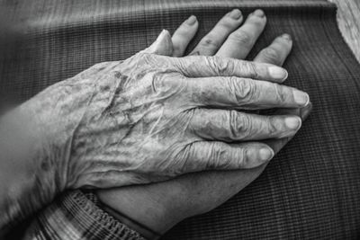 Cropped hands of senior couple