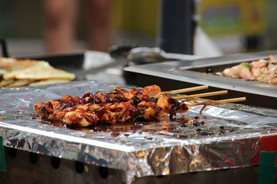 Close-up of meat on barbecue grill