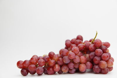 Close-up of grapes against white background