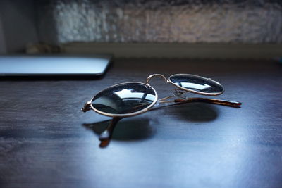 Close-up of sunglasses on table