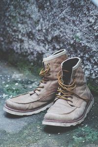 Close-up of shoes on rock