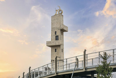 Low angle view of tower bridge against sky during sunset