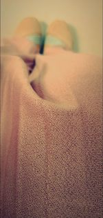 Woman sleeping on bed at home