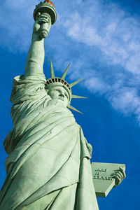 Low angle view of statue against cloudy sky