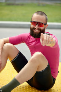 Portrait of young man exercising in gym