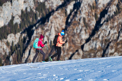 Group of people on snow covered mountain